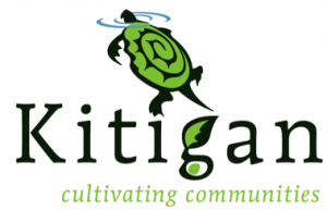 Kitigan Logo. Image of a green turtle with a spiral on its back, its head just above the water. Below is the name Kitigan in black, except the top of the  "g" is shaped like a leaf and also green. In small green letters at the bottom are the words "cultivating communities"